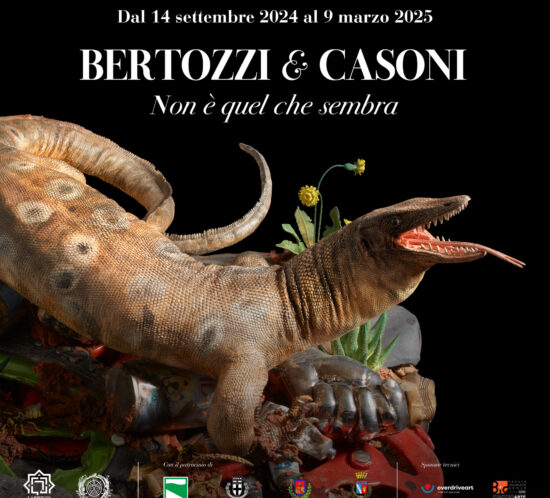 A detailed sculpture of a lizard-like creature among plants and debris, with colorful details and expressive features.